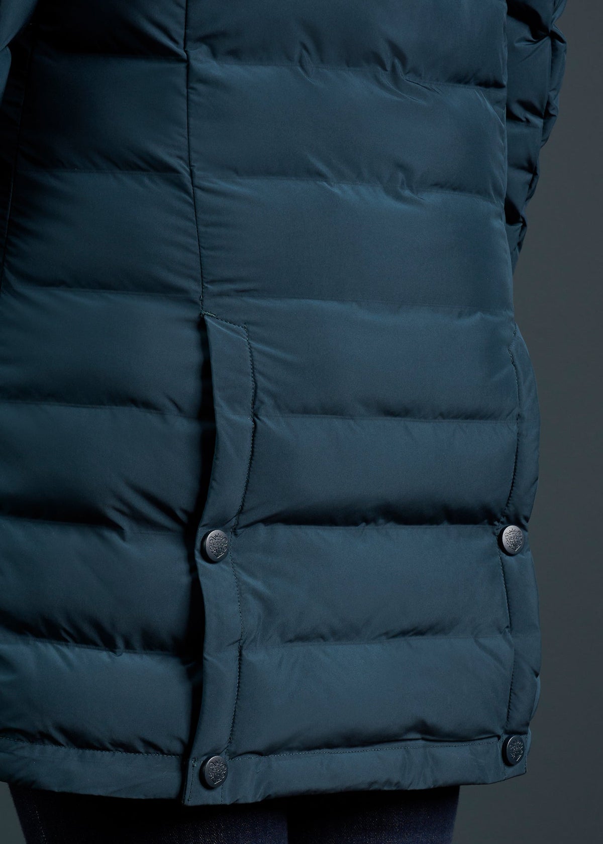 Close-up of the Calsall Ladies Coat in Navy, regular fit, with side buttons and horizontal quilting details.