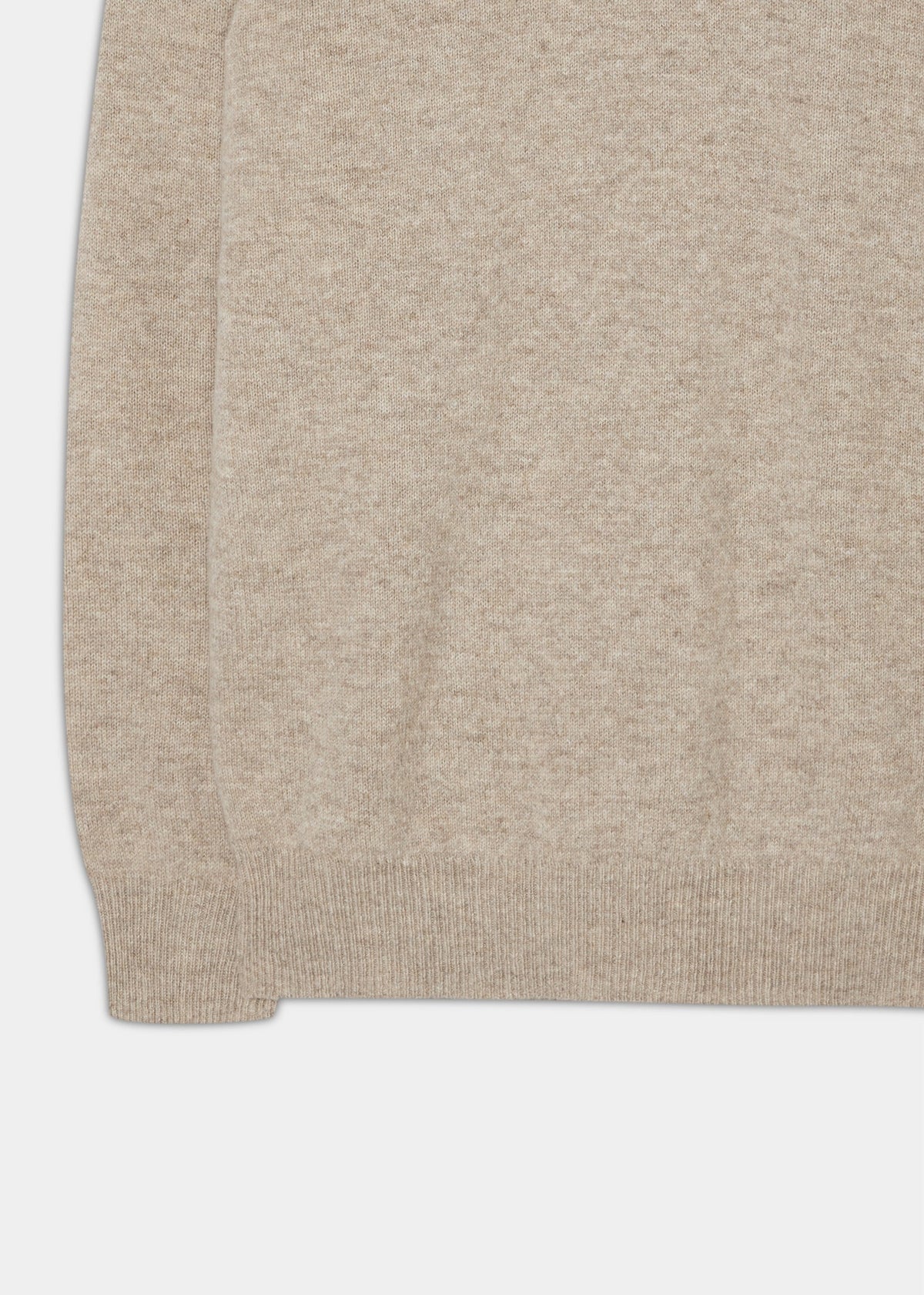 Close-up of Dorset Lambswool Crew Neck Jumper in Cobble, Classic Fit, showing ribbed hem and cuff on white background.