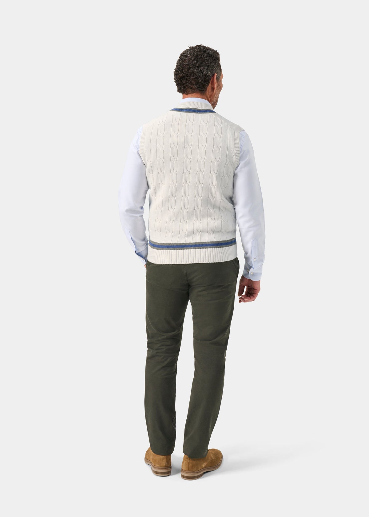 Man in Chadbury Cotton Cable Knit V-Neck Cricket Slipover (Ecru/Landscape), light shirt, green pants, brown shoes.
