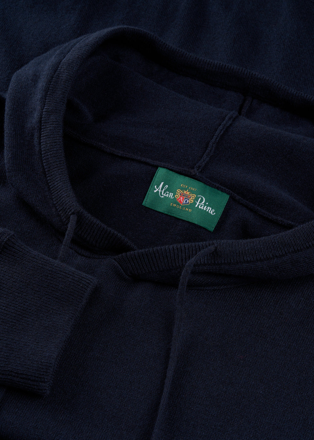 Close-up of the Gaisby Cotton Merino Hoodie in Dark Navy - Regular Fit, featuring an Alan Paine label at the neckline.