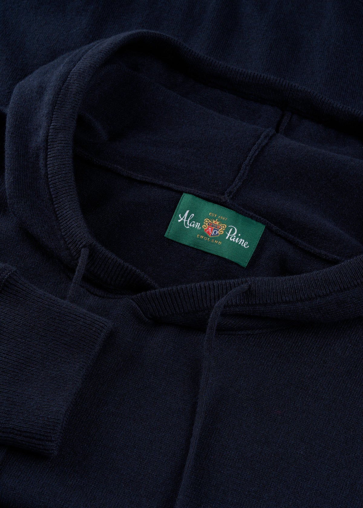 Close-up of the Gaisby Cotton Merino Hoodie in Dark Navy - Regular Fit, featuring an Alan Paine label at the neckline.