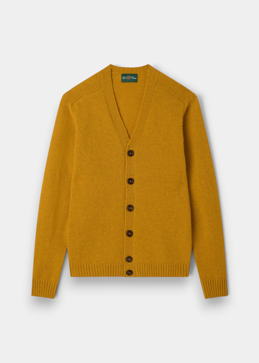 Kinloch Supersoft Shetland Wool V-Neck Cardigan in Old Gold with dark buttons, ribbed cuffs, flat on white background.