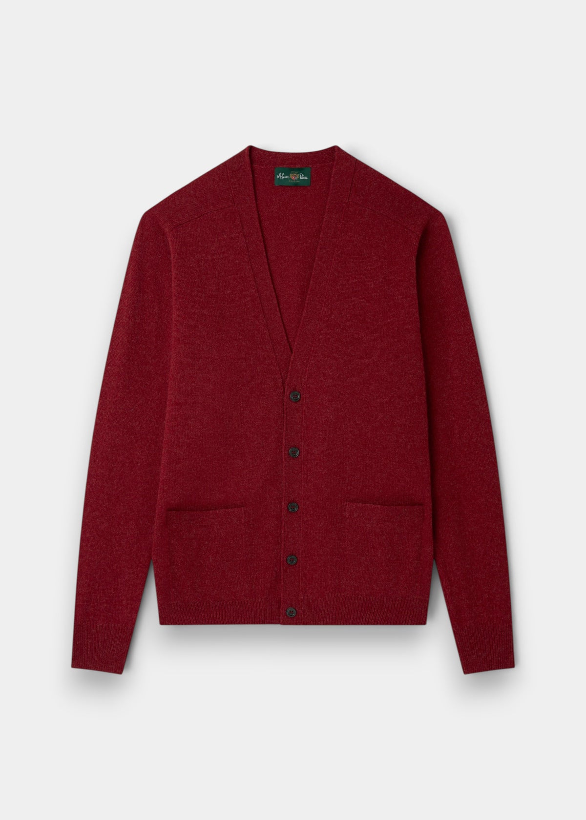 Cornwall Lambswool V-Neck Cardigan in Poppy Melange, classic fit, with two pockets on a light grey background.
