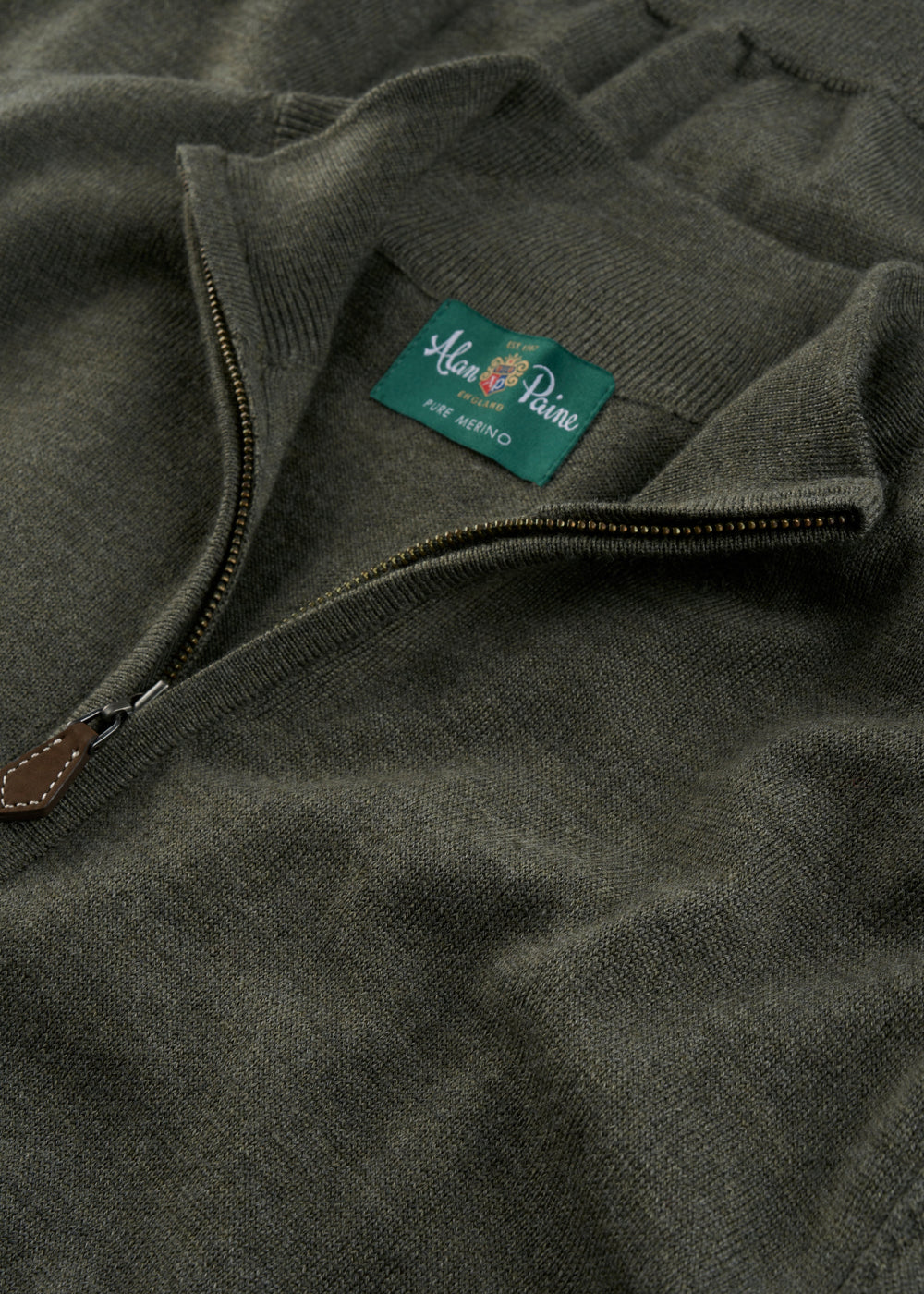 Close-up of a Barton Merino Wool Quarter Zip Jumper in Seaweed, regular fit, with Alan Paine label inside collar.