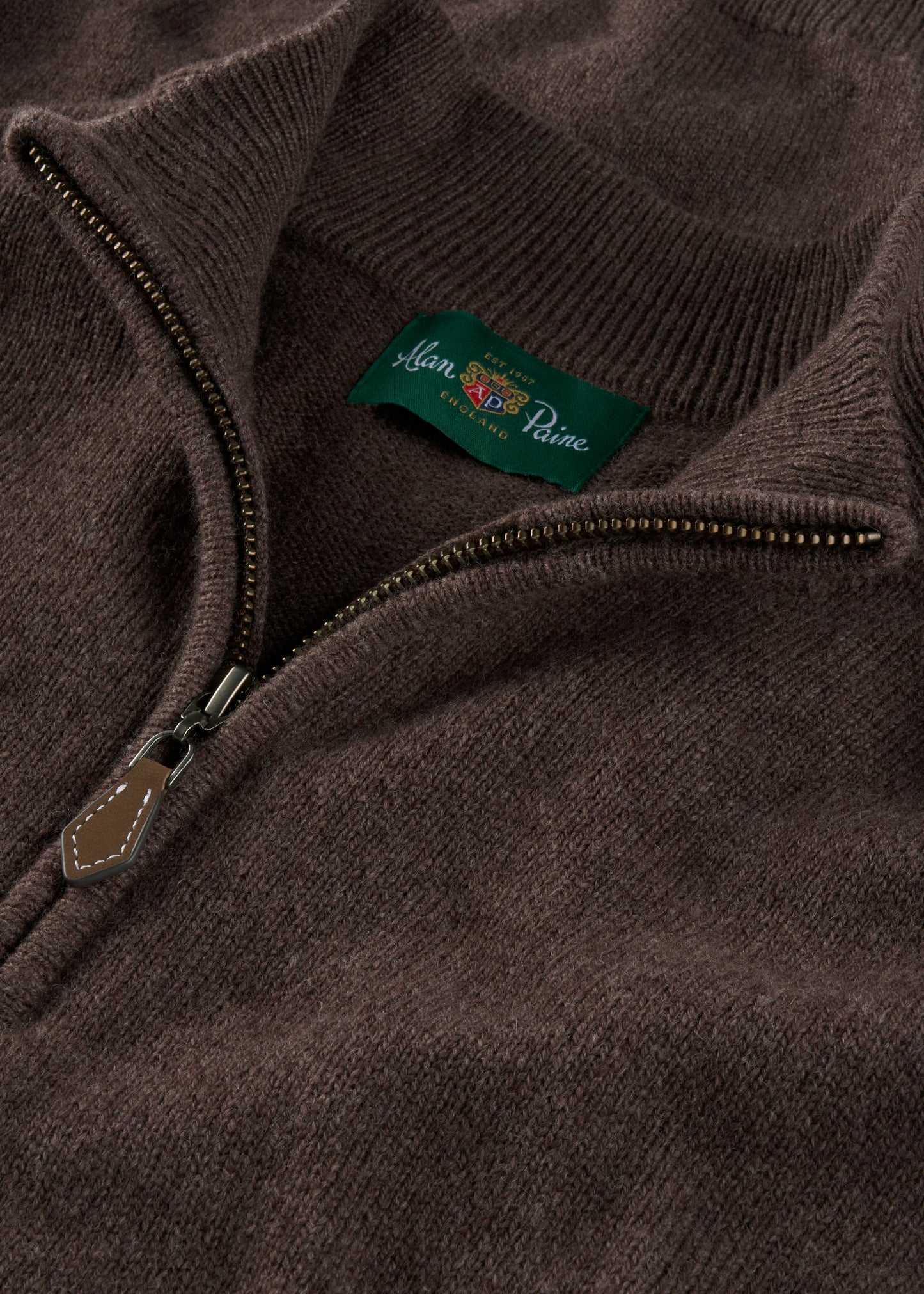 Close-up of a brown quarter zip jumper